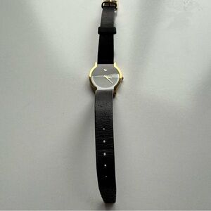 Genuine Movado watch in Gold and Black.